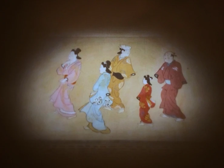 several asian ladies in traditional costumes on a wall
