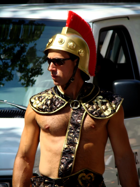 a man with a shirtless torso and roman helmet