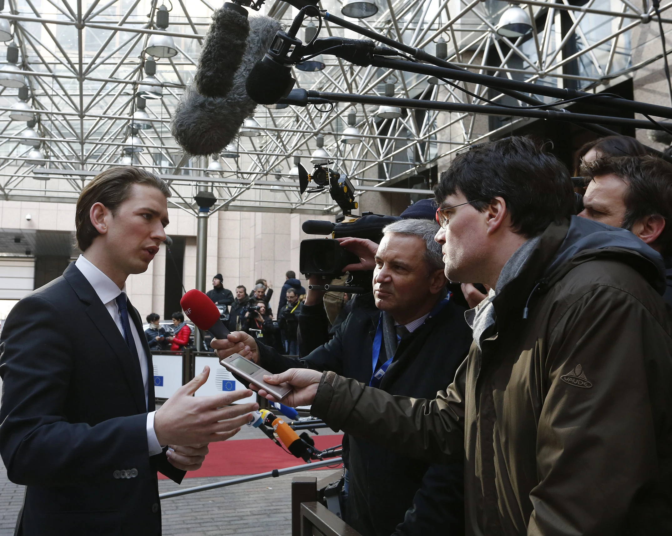 a man talking to a group of people