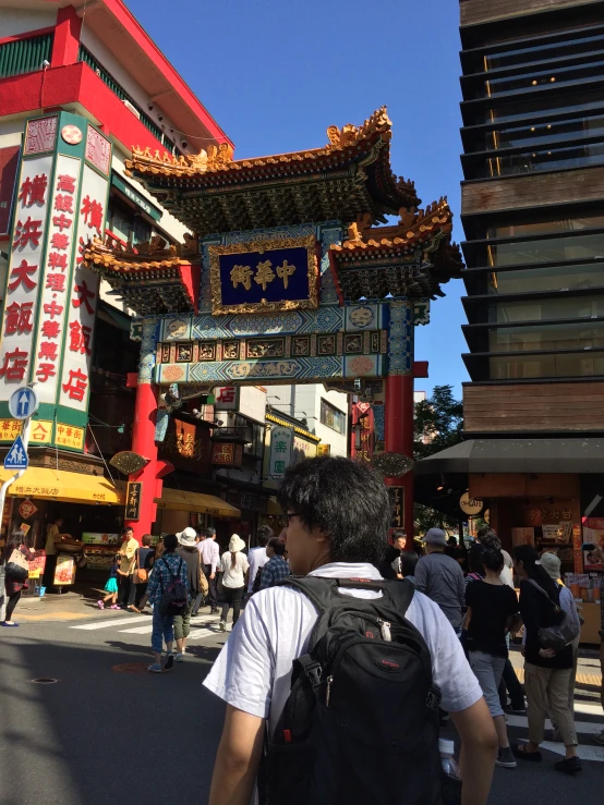 a very tall building with many banners around it