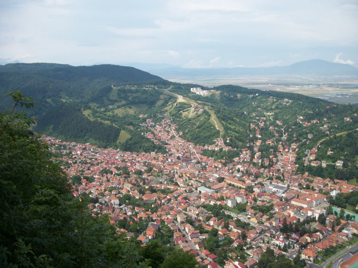 aerial view of a city from top of a hill