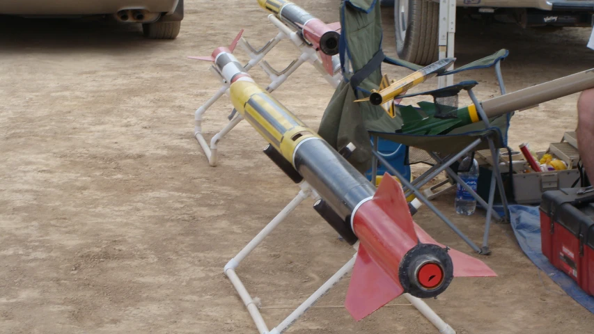 a big colorful rocket with people in a background