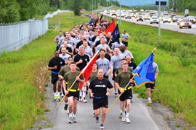 a large group of people that are running down the road