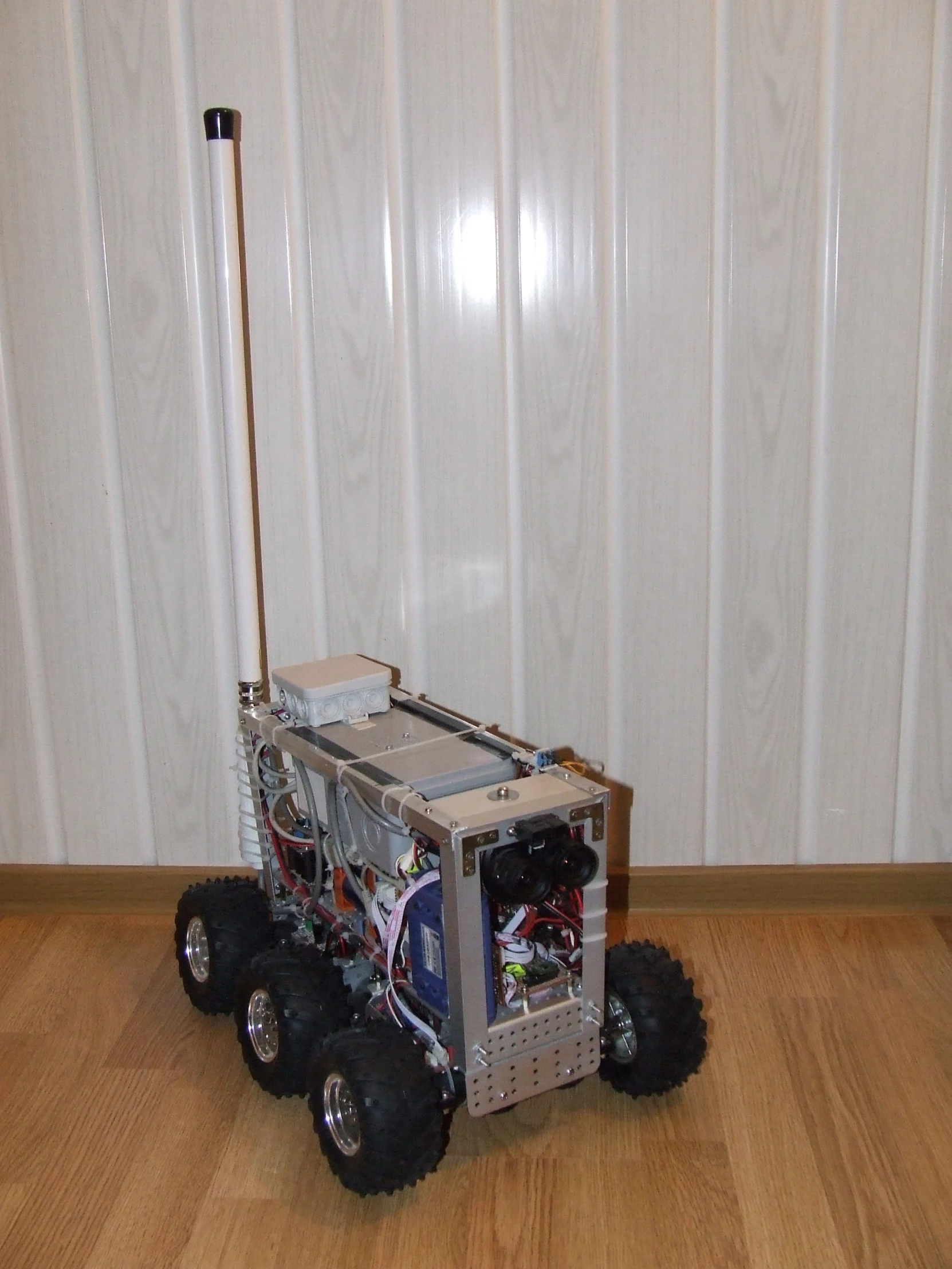 a robotic vehicle with four wheels on the ground