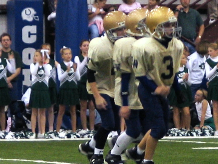 the team huddle together for a timeout on the sideline