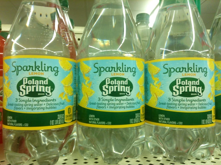 three bottles of sprouling spring forward beverages sitting on a shelf