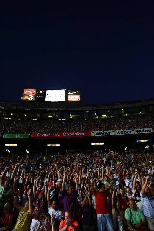 fans at a game cheering their team