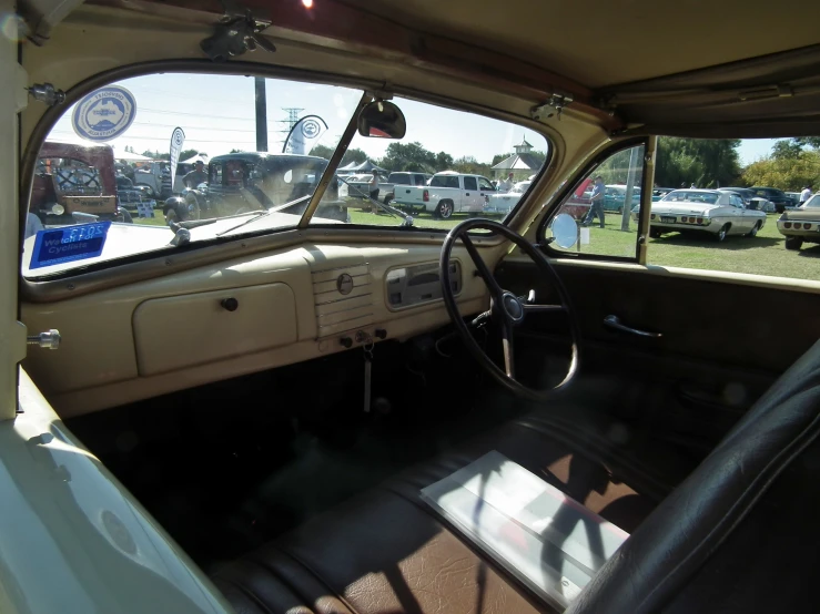 an interior view of a white car with leather seats