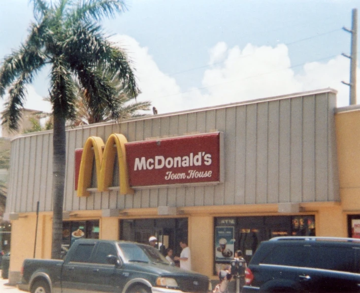 the front view of a fast food restaurant that is under construction
