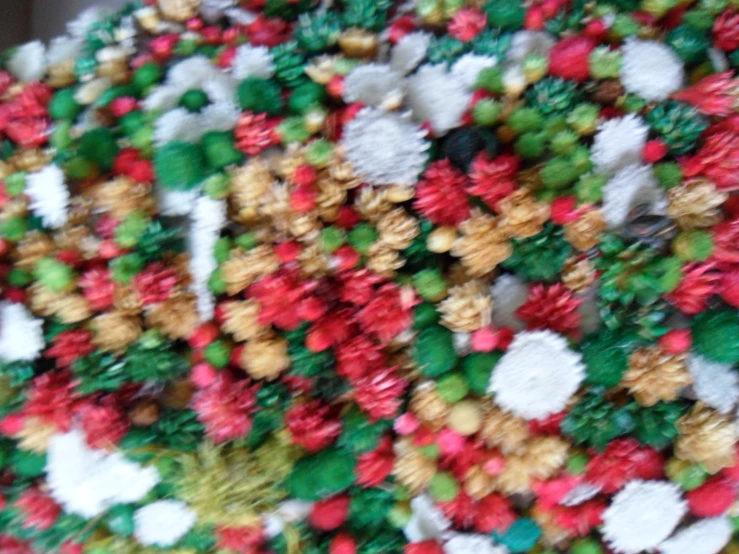 a decorative plate of christmas treats is made out of icing and candy canes