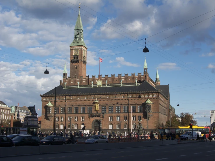 an old castle like building with a steeple and a clock tower