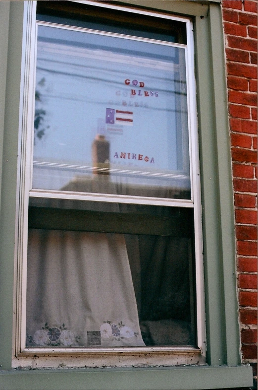 there is a curtain that appears to be covered by someone else