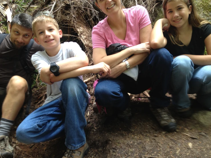 some people sit together in the dirt