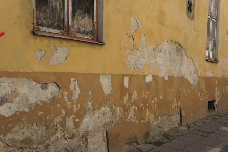 a building has torn down paint on it