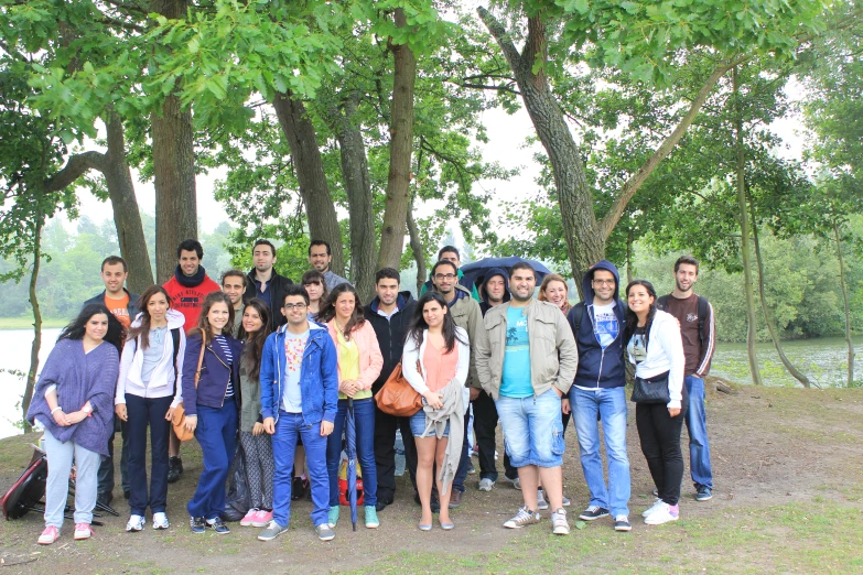 a group of people in a park under a tree