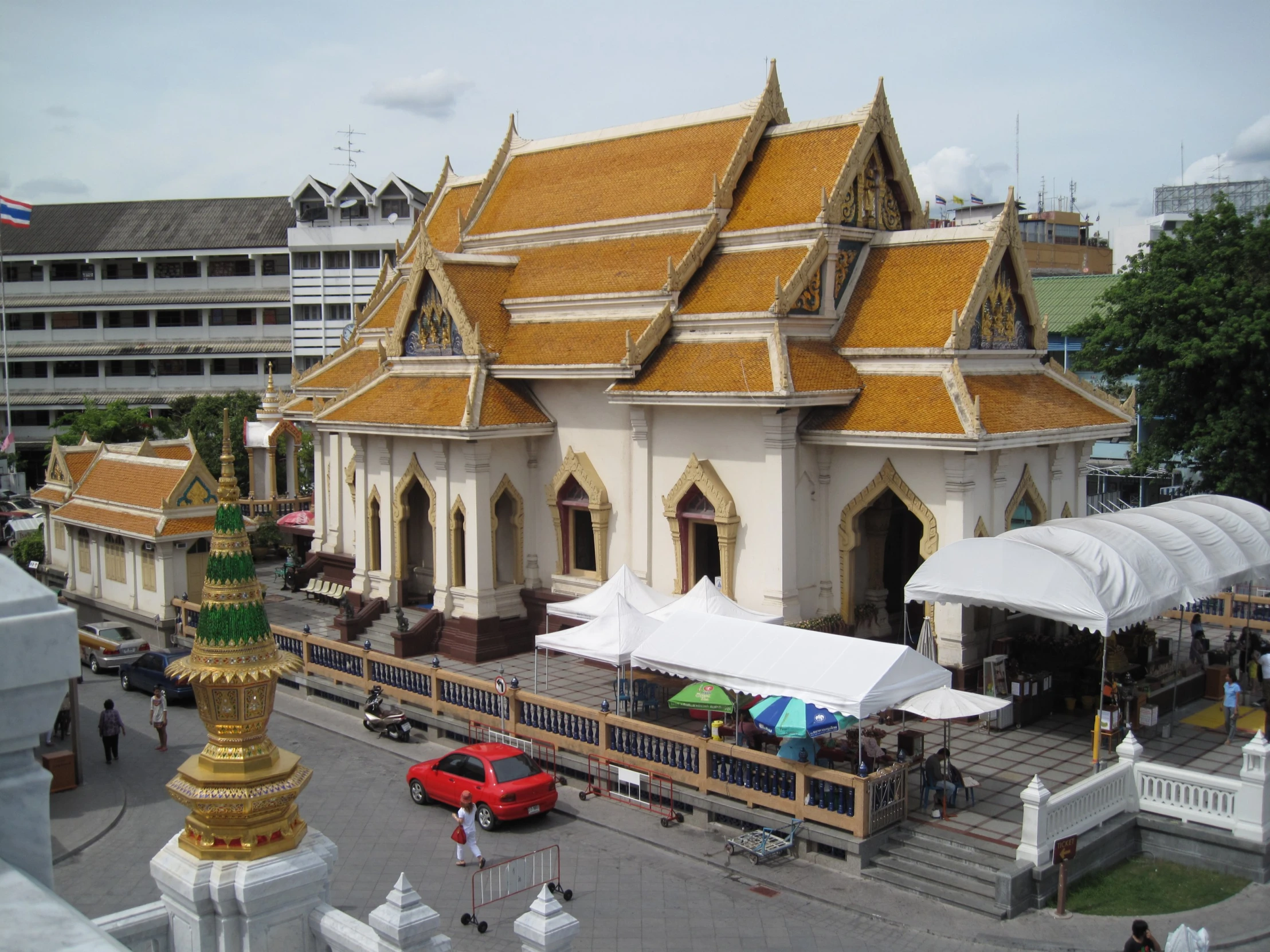 an old church has gold tile on the roof