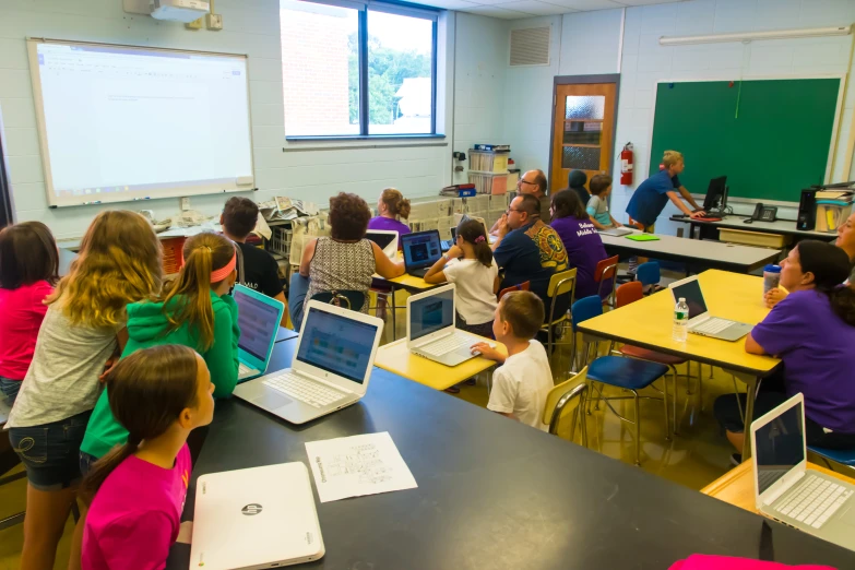 an instructor is teaching a class with children