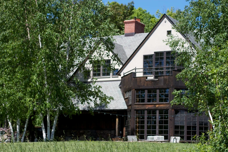 a picture of a large house surrounded by trees