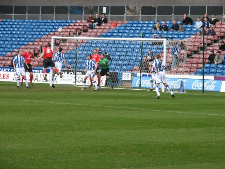 the men are playing soccer on the field