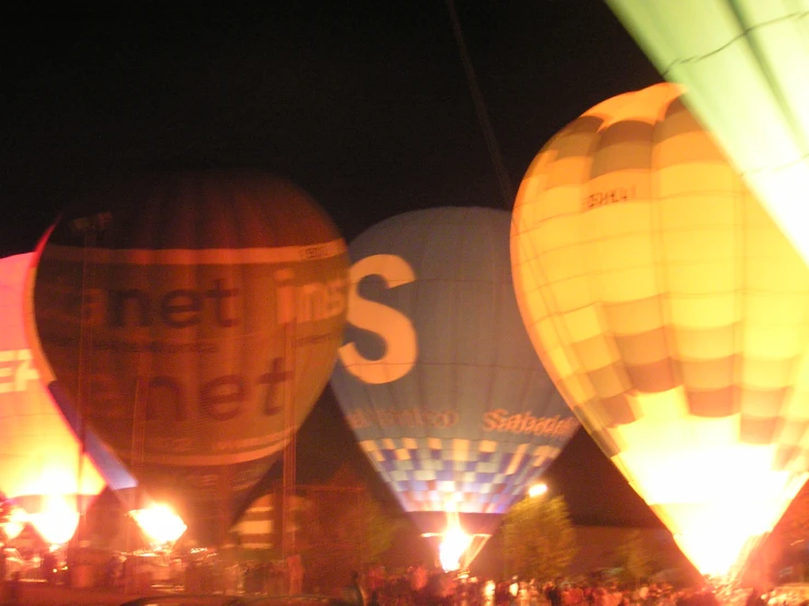 colorful  air balloons flying above a crowd