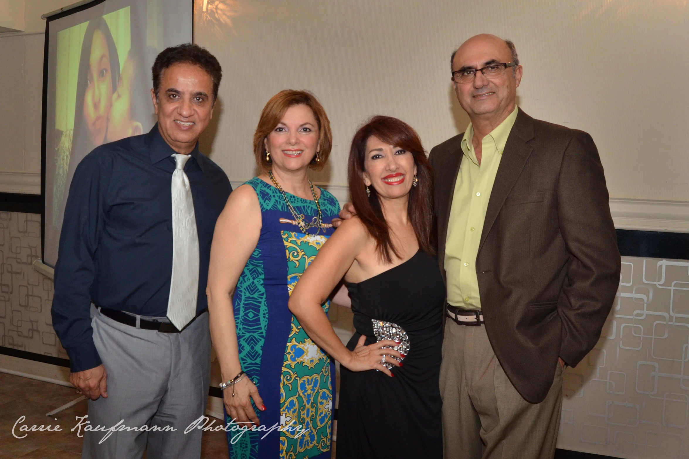 two couples and a business man at a conference