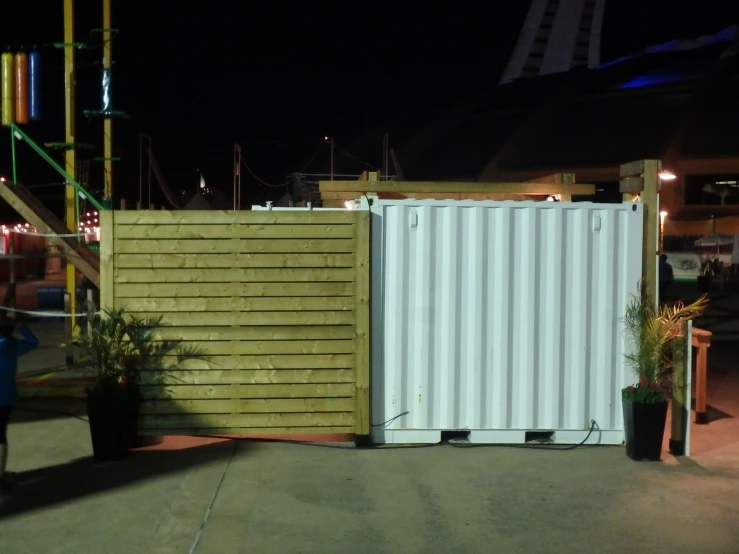 two tall yellow and white containers with metal dividers