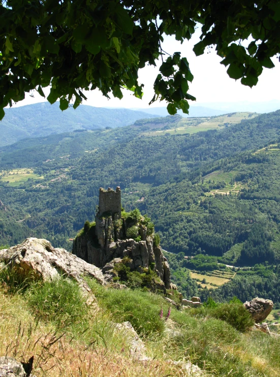 a scenic view of the countryside and the mountains