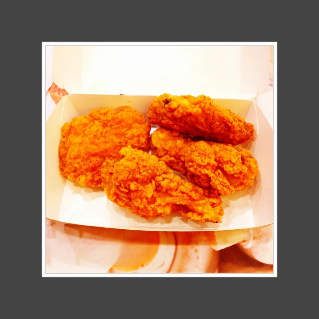 fried chicken in a carton for serving as a meal