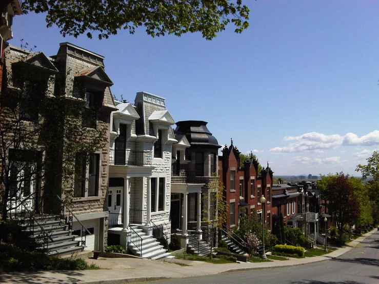 a row of homes in a street on a hill