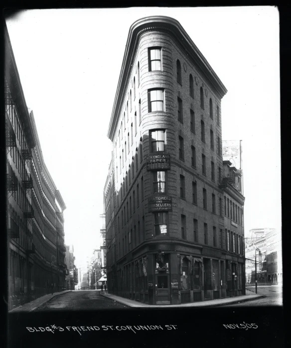 a tall building with many windows next to traffic