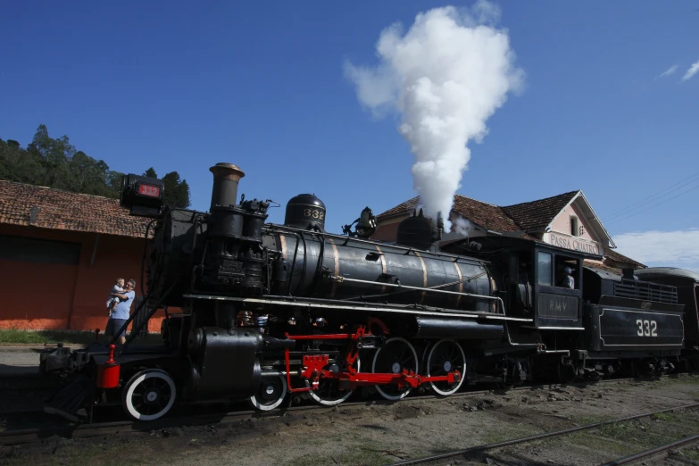 a very long black train on a track