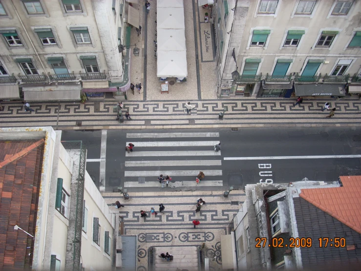 top view of various buildings and people walking in street