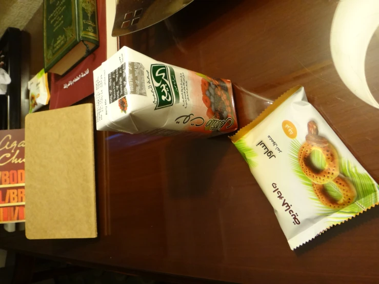 a brown table topped with a box of donuts