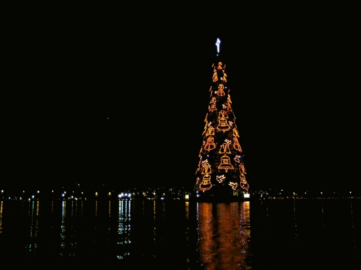 the lit up tree in the distance is lit up with lights