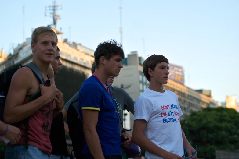 four young men standing near one another