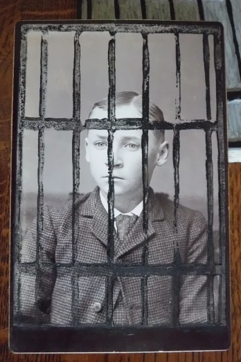 the young man is in a  cell