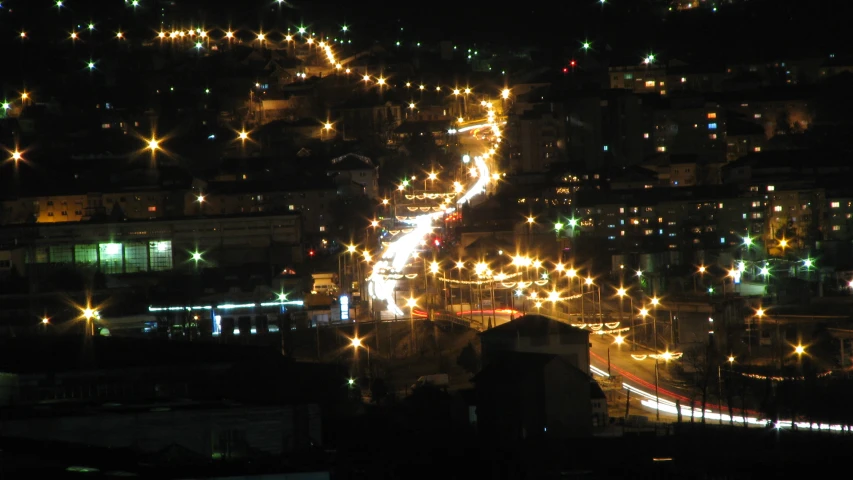 a city with many lights on the city street