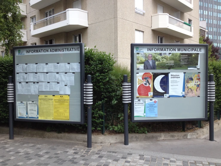 two signs advertising the preparation for an upcoming olympics