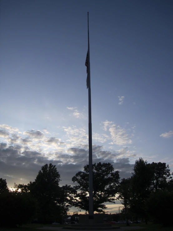 there is a large flagpole with a flag on top of it