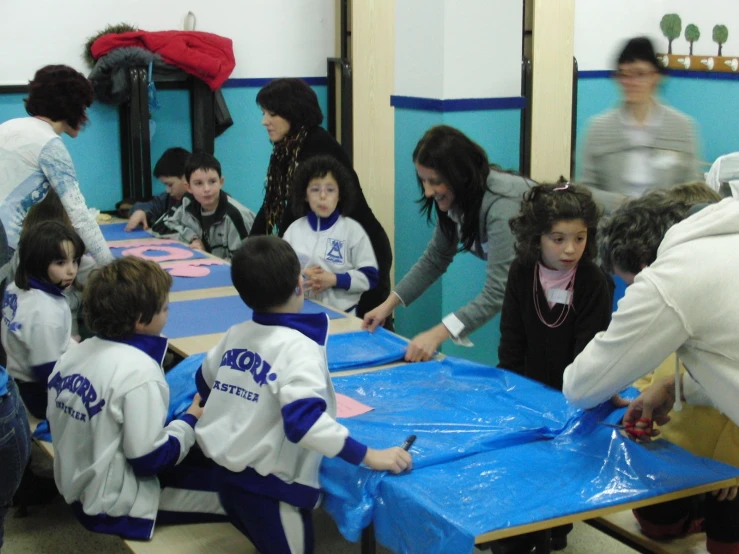 people at tables with children at the table