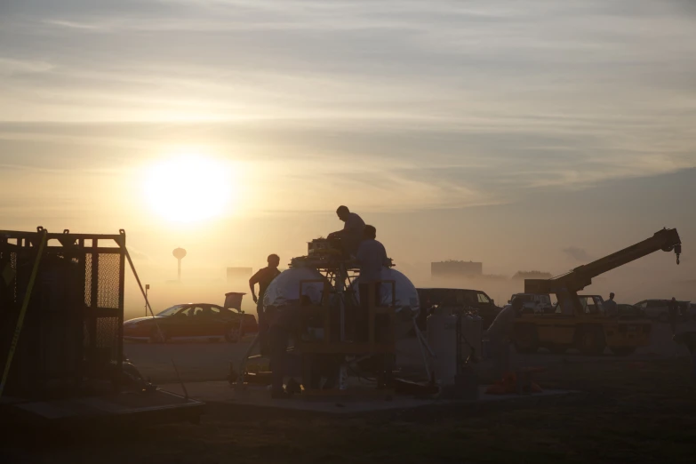 the workers are working on the construction of the new street lights