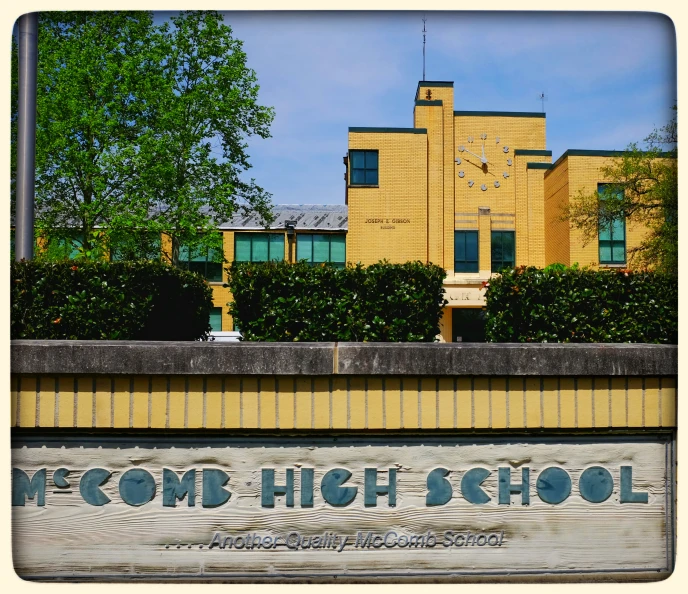 an old building with a large white sign underneath it