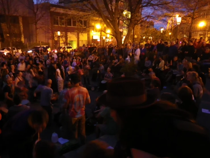 large group of people gathered together on a city street