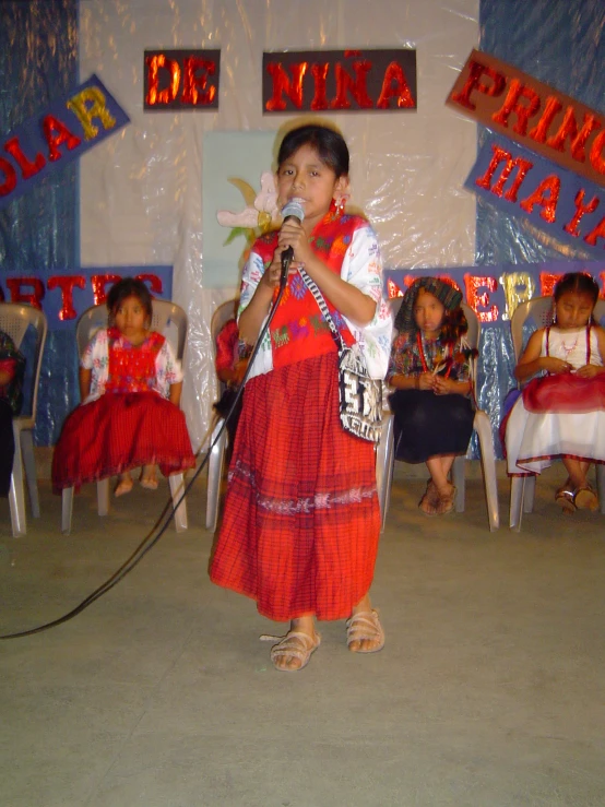 an image of a boy with a microphone