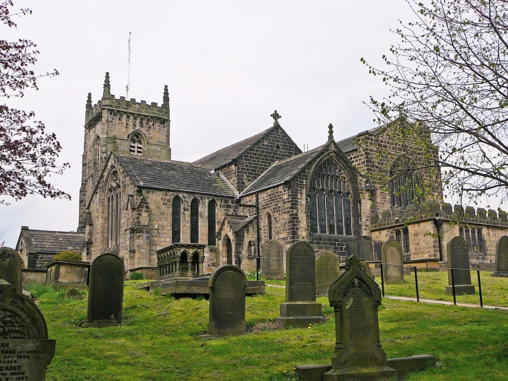 an old church in the middle of a cemetery