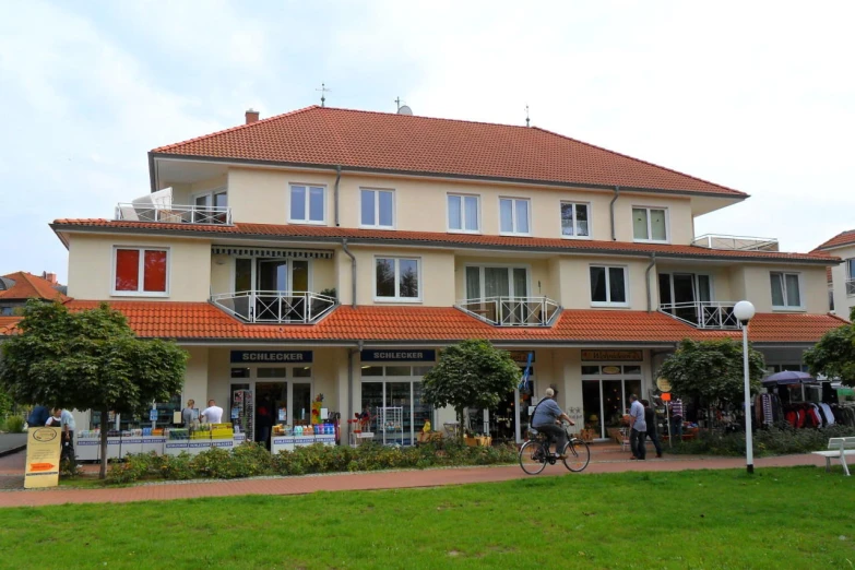 an image of a large home with bicycle parked in front