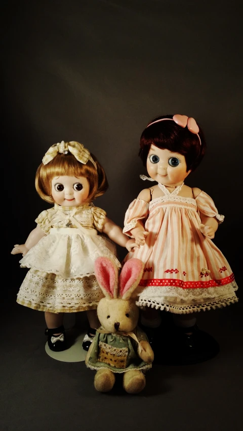 two dolls are posed together in this po