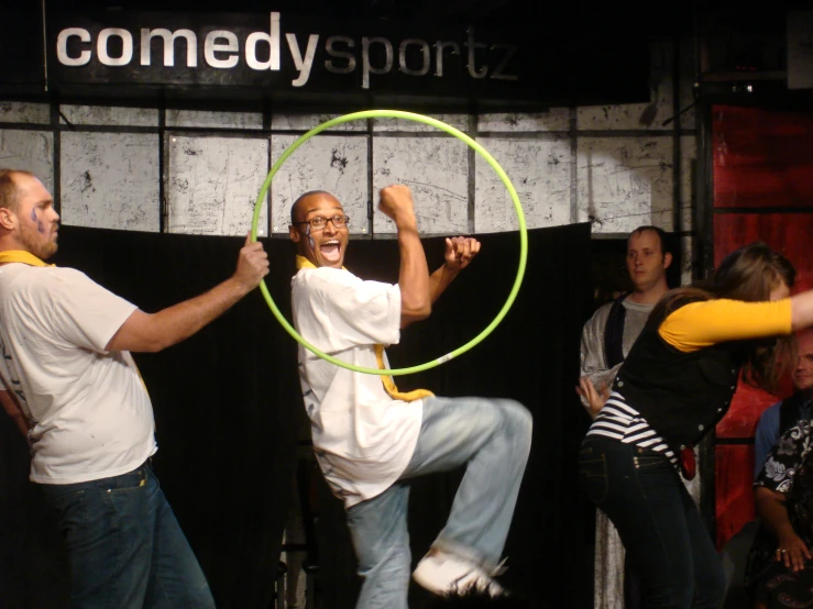 a young man using a hoop as a hoop for a sport