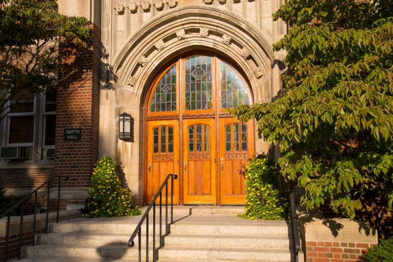 a beautiful building with a big bright yellow door