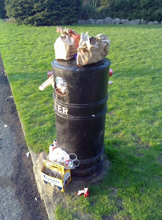 there are garbage bags and other items in a bin